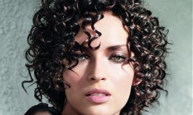Fashionable hairstyle with gel, varnish, curl styling products at home
